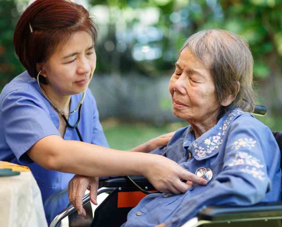 Homecare working helping elderly lady