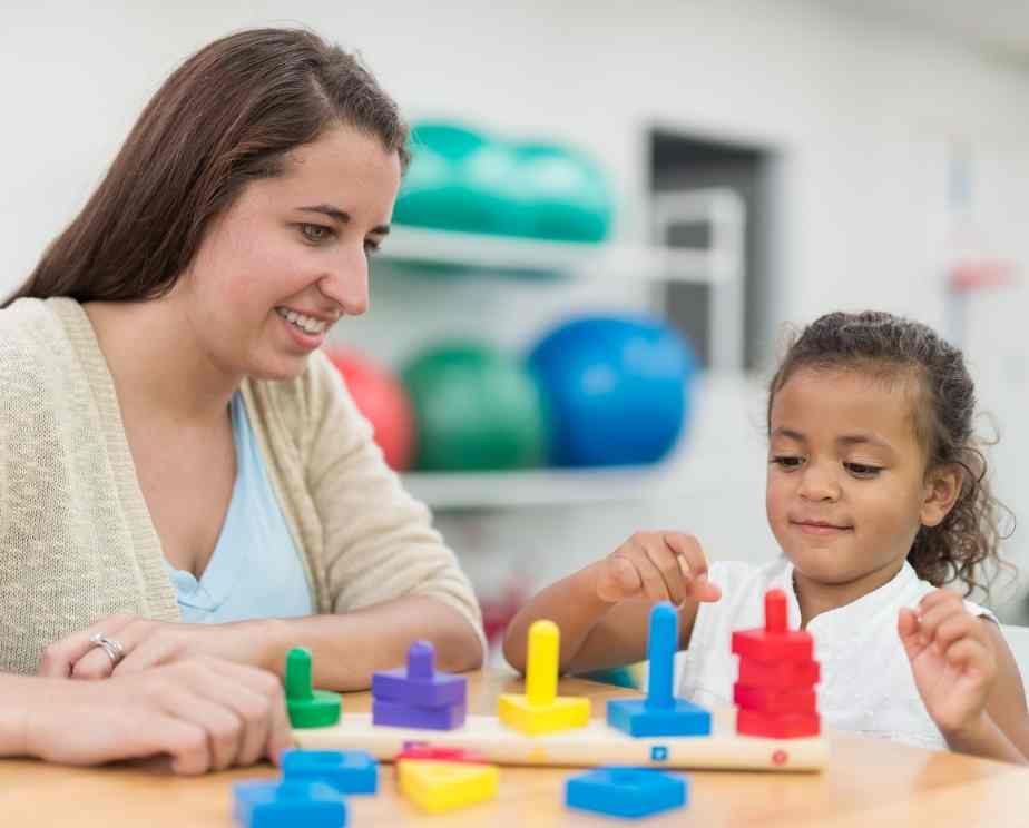 occupational therapist helping a child