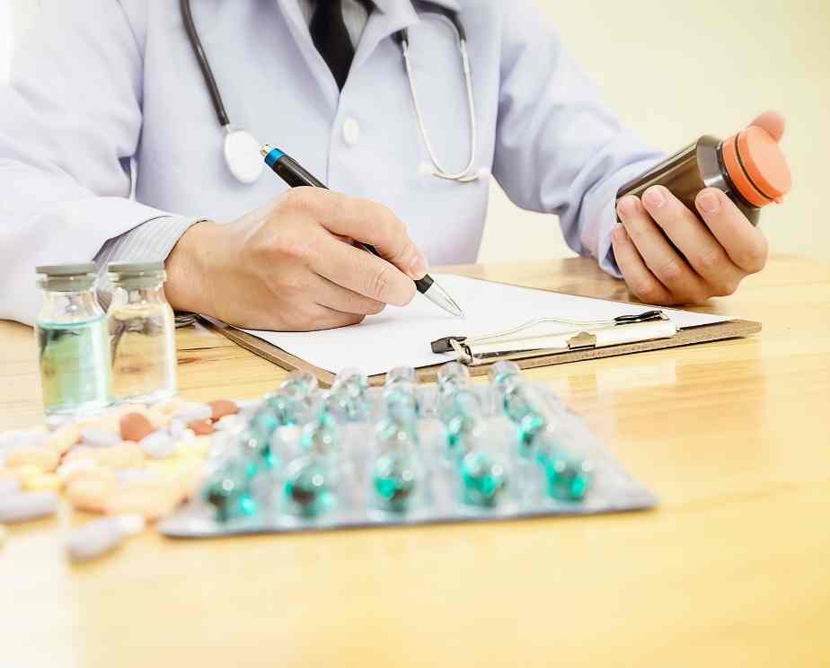 pharmacist making notes on medication