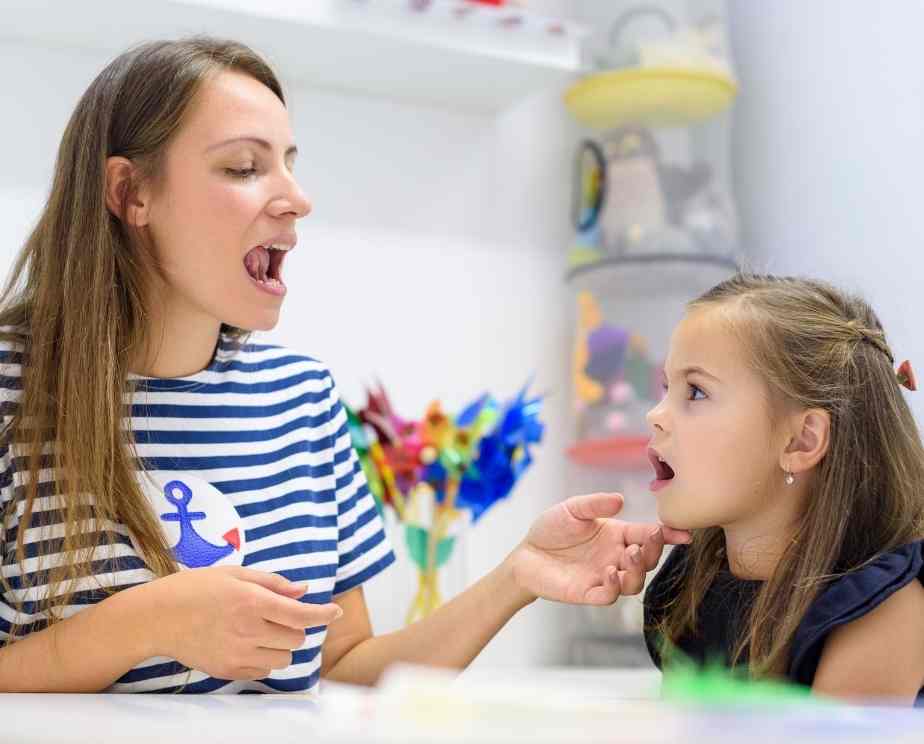 Speech and language therapist working with a child