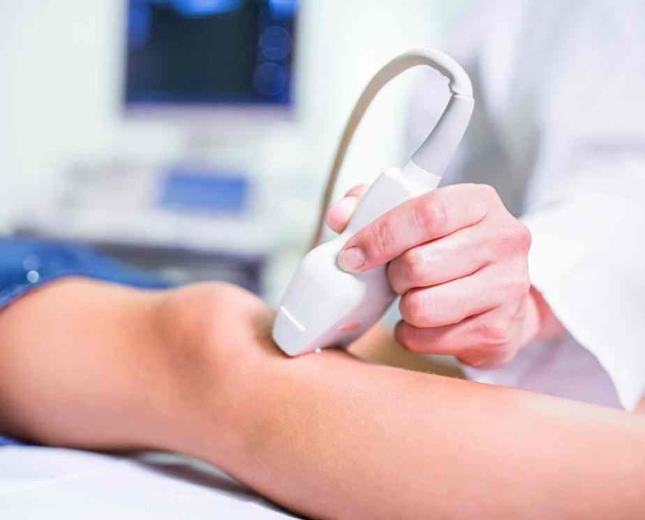 Sonographer doing an ultrasound on a patients knee